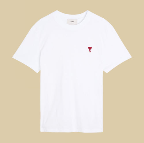 Ami paris White t-shirt with a red heart logo on a beige background