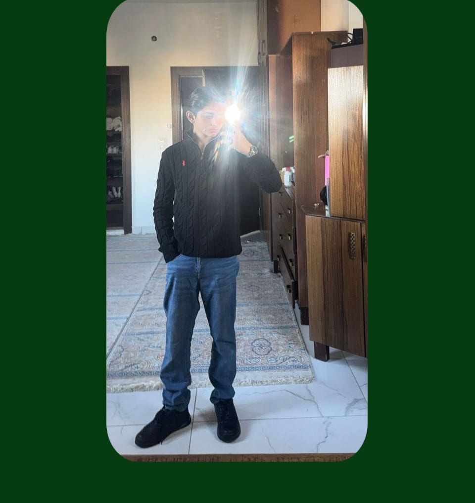 A customer taking A mirror Pic wearing Ralph Lauren Black Cable-Knit Cotton Quarter-Zip Jumper for a review 